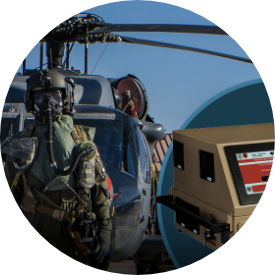 Photo of soldiers standing in front of a helicopter with CHEMERA chemical detection and analysis device.