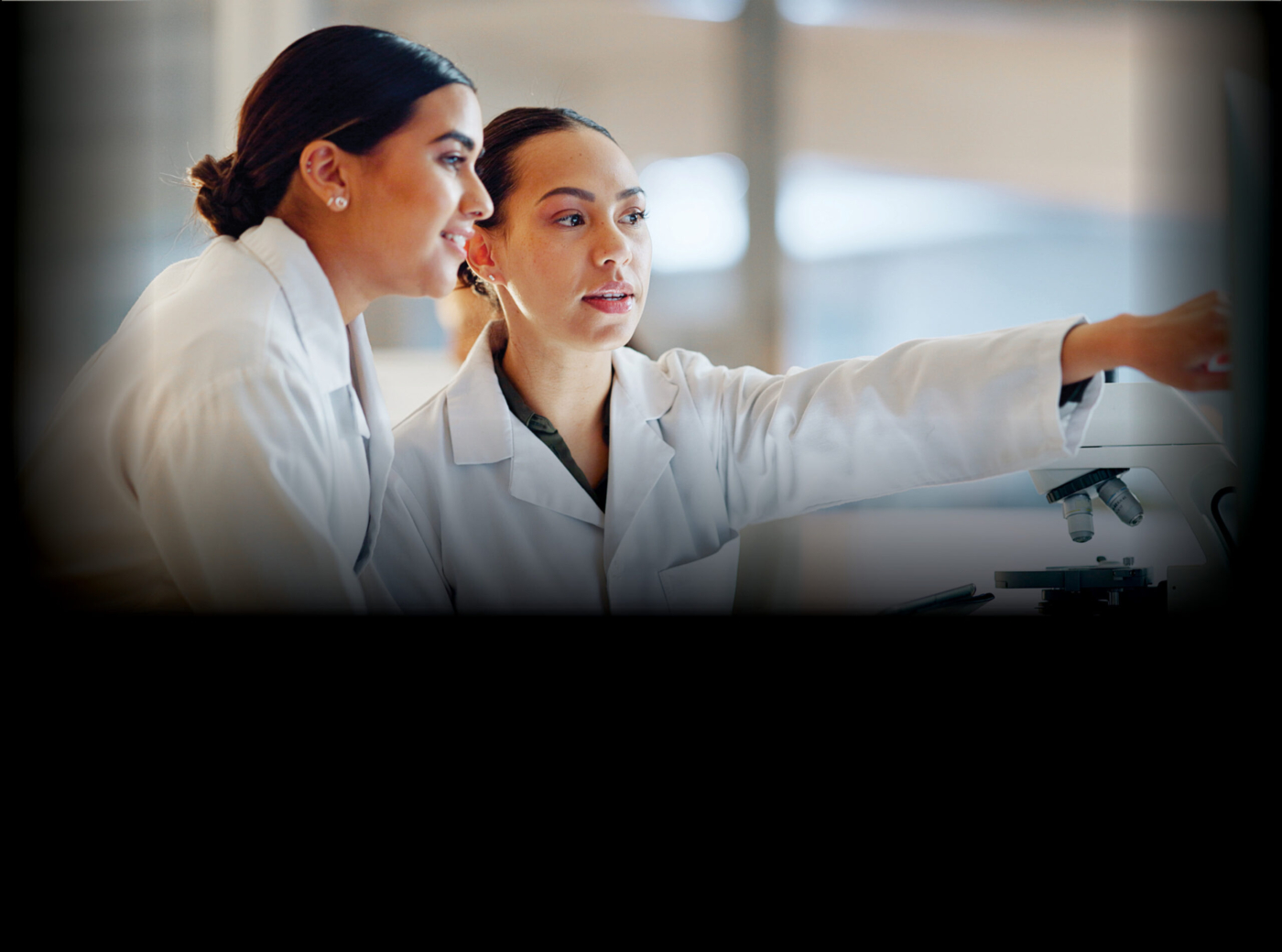 Two female scientists in discussion.